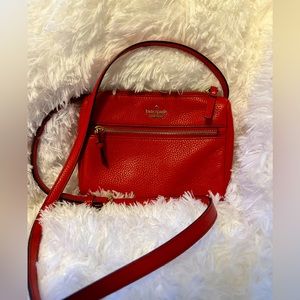 Kate Spade Crossbody Bag in red. Would be a great item for your Holiday wardrobe